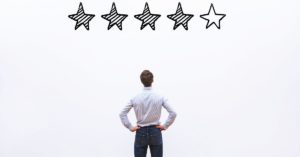 man staring at 5 star review